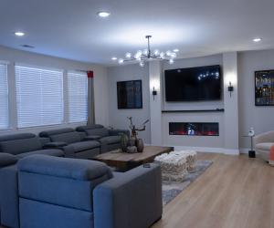 basement remodel with media room, custom gas fireplace, 2021