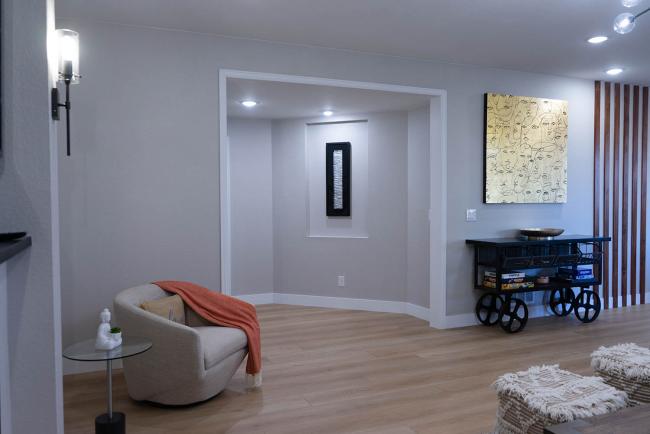 basement remodel with built in art displays, custom architectural wood detailing, 2021