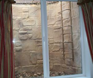 Basement Egress Window Wrapped in Stone