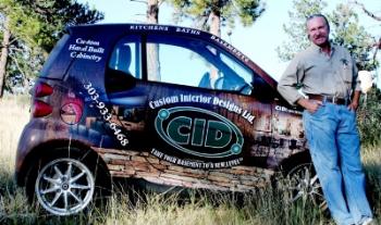 Jerry Vidmar with our basement remodeling company car