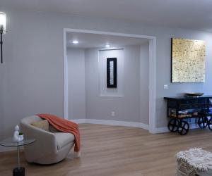 basement remodel with built in art displays, custom architectural wood detailing, 2021