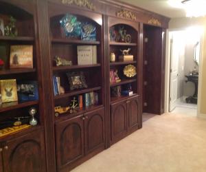 Castle Pines bookshelf and bathroom with open hidden room