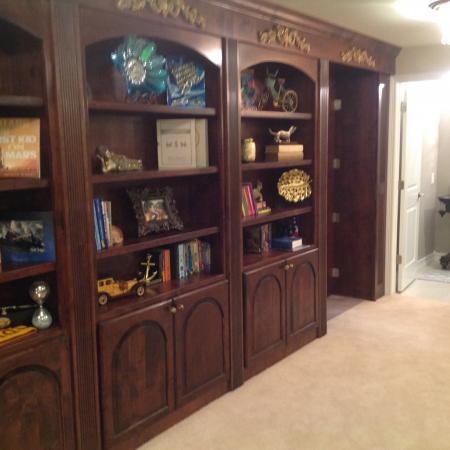 Castle Pines bookshelf and bathroom with open hidden room